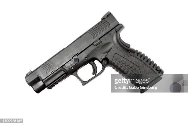 9mm handgun on a white background - pistol stock pictures, royalty-free photos & images