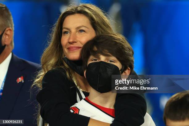 Gisele Bundchen celebrates with John Moynahan after the Buccaneers defeated the Kansas City Chiefs in Super Bowl LV at Raymond James Stadium on...