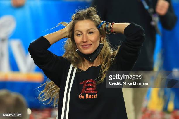 Gisele Bundchen, wife of Tom Brady of the Tampa Bay Buccaneers, celebrates after the Buccaneers defeated the Kansas City Chiefs in Super Bowl LV at...