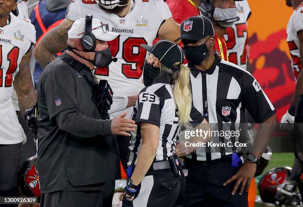 Head coach Bruce Arians of the Tampa Bay Buccaneers speaks with line judge Sarah Thomas and umpire Ruben Fowler in Super Bowl LV at Raymond James...