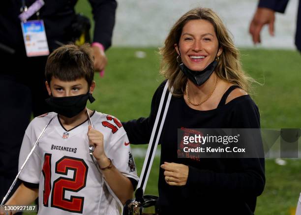 Gisele Bundchen, wife of Tom Brady of the Tampa Bay Buccaneers, celebrates with Benjamin Brady after the Buccaneers defeated the Kansas City Chiefs...