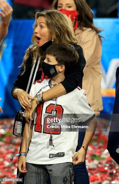 Gisele Bundchen, wife of Tom Brady of the Tampa Bay Buccaneers, celebrates with Benjamin Brady after the Buccaneers defeated the Kansas City Chiefs...