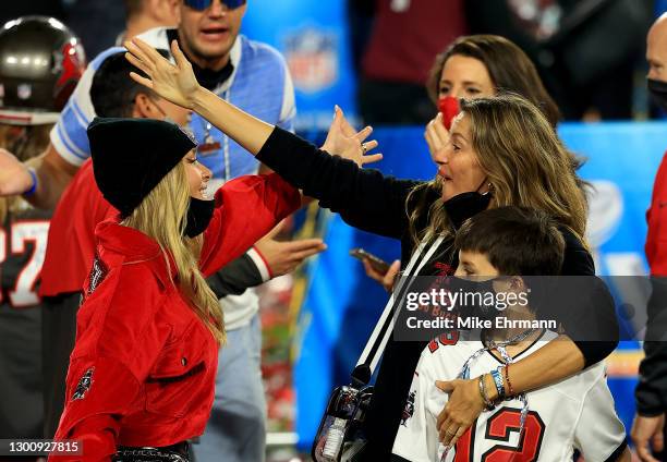 Gisele Bundchen, wife of Tom Brady of the Tampa Bay Buccaneers, celebrates with Benjamin Brady after the Buccaneers defeated the Kansas City Chiefs...