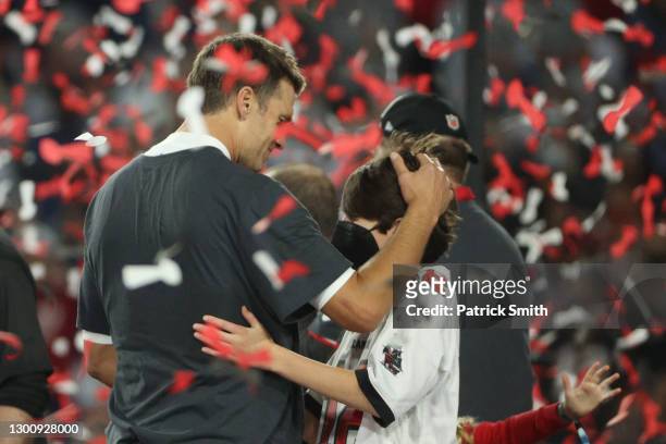 Tom Brady of the Tampa Bay Buccaneers celebrates with John Moynahan after defeating the Kansas City Chiefs in Super Bowl LV at Raymond James Stadium...