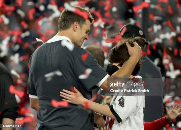 Tom Brady of the Tampa Bay Buccaneers celebrates with John Moynahan after defeating the Kansas City Chiefs in Super Bowl LV at Raymond James Stadium...