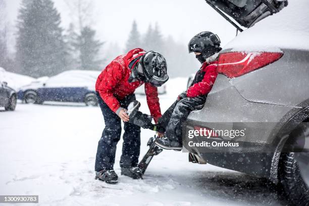 mother and son preparing for ski during covid-19 pandemic - wintersport stock pictures, royalty-free photos & images