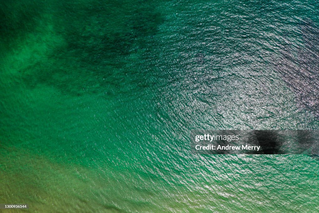 Calm green sea, wave pattern, aerial view, close up
