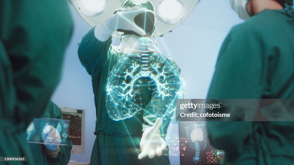 Innovation and Medical technology Concept, Surgeons Team using hi-tech modern virtual reality simulator interface with Hologram diagnose Respiratory System in the operating room