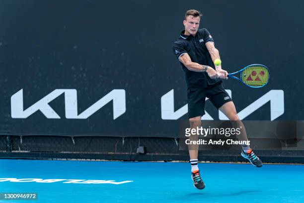 Marton Fucsovics of Hungary plays a backhand in his Men's Singles first round match against Marc Polmans of Australia during day one of the 2021...
