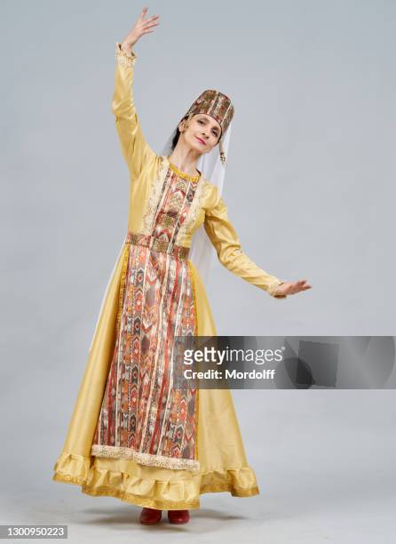 nice woman dancer in national dress is dancing armenian traditional dance - beautiful armenian women stock pictures, royalty-free photos & images
