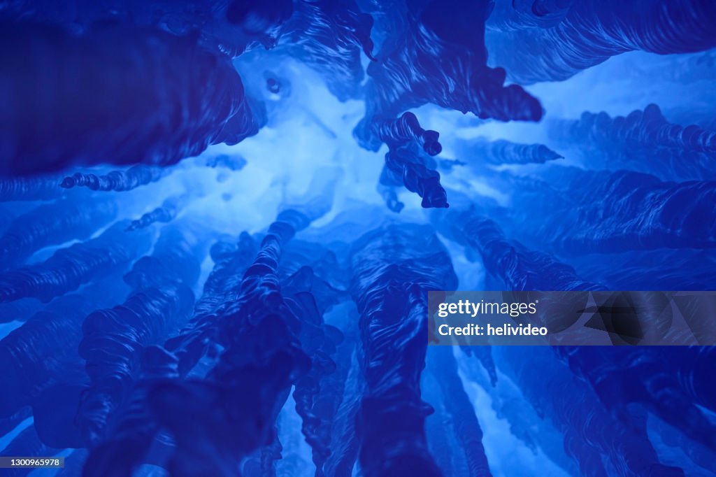 BOTTOM UP: Breathtaking view of stalactites and stalagmites inside an ice grotto