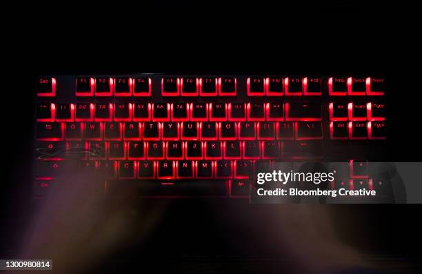 laptop keyboard and cyber crime - data breach fotografías e imágenes de stock