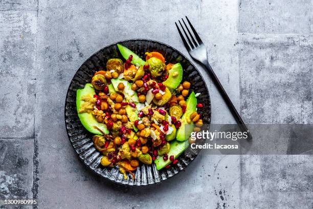 brussels sprouts, sweat potatoes, chick peas, avocado - chick pea salad stock pictures, royalty-free photos & images
