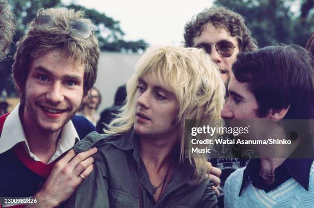 Queen backstage at a free concert in Hyde Park, London, 18th September 1975. Roger Taylor, John Reid and others.