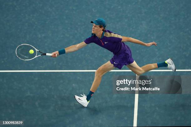 Jannik Sinner of Italy plays a forehand in his Men's Singles first round match against Denis Shapovalov of Canada during day one of the 2021...