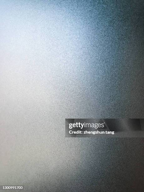 abstract side lit matte metallic texture - brightly lit ストックフォトと画像