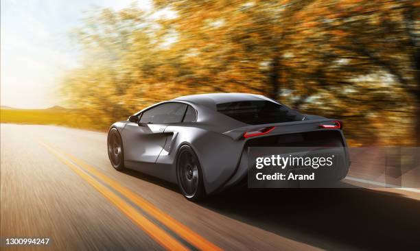 grey sportscar driving on a road - looking from rear of vehicle point of view stock pictures, royalty-free photos & images
