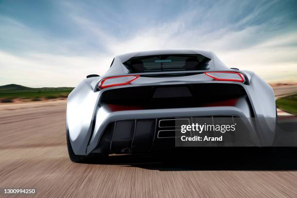 grey sportscar driving on a race track - looking from rear of vehicle point of view stock pictures, royalty-free photos & images