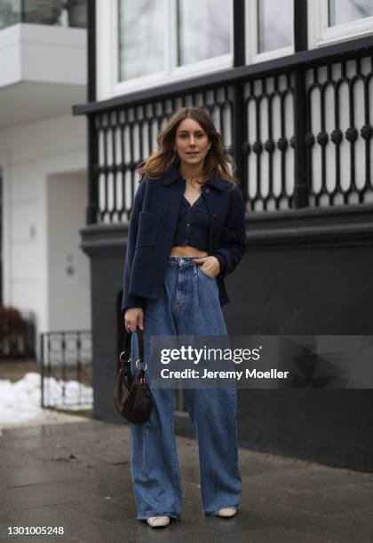 Maike Schmitz wearing Massimo Dutti jacket, Zara jacket and jeans, Vagabond shoes and brown Prada bag on February 03, 2021 in Hamburg, Germany.