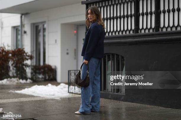 Maike Schmitz wearing Massimo Dutti jacket, Zara jacket and jeans, Vagabond shoes and brown Prada bag on February 03, 2021 in Hamburg, Germany.