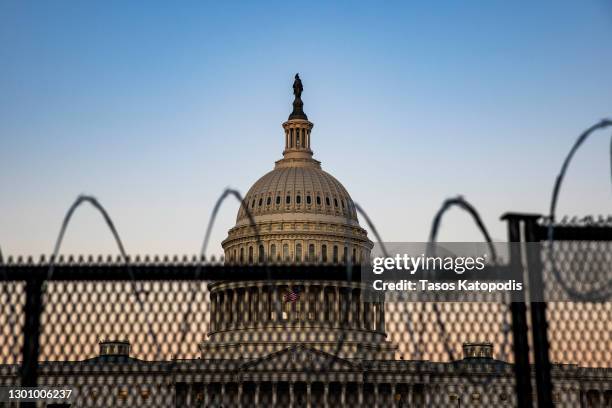 The US Capital is seen as National Guard and US Capitol Police stand guard on February 08, 2021 in Washington, DC. Trump faces a single article of...