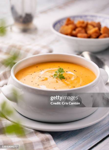 carrot soup with cream and croutons - cream soup stock pictures, royalty-free photos & images