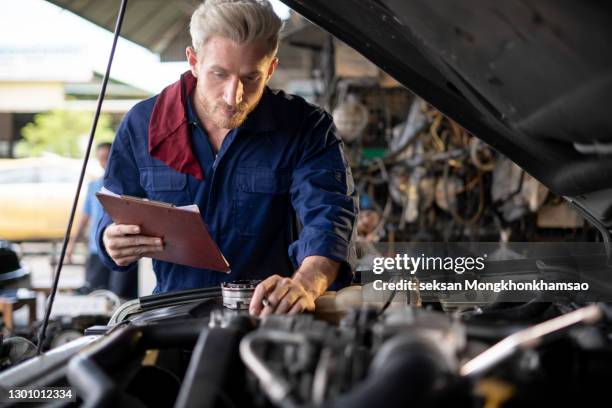 mechanic at work in his garage - auto tuning stock pictures, royalty-free photos & images