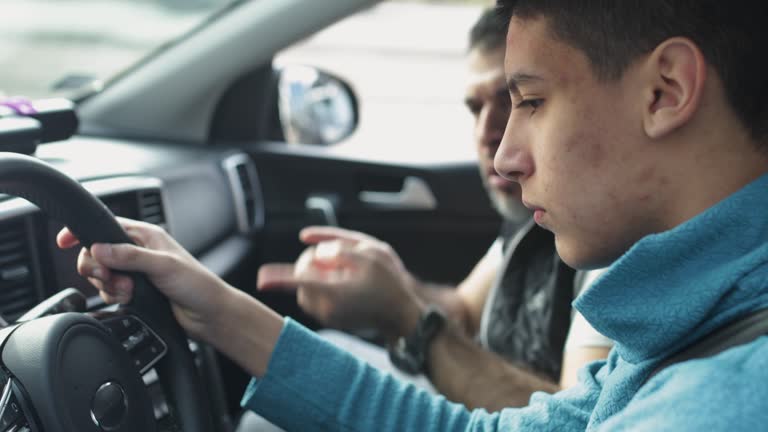 https://media.gettyimages.com/id/1301019259/video/teenage-boy-having-driving-lesson-with-male-instructor.jpg?b=1&s=640x640&k=20&c=HSX_65sSuEfr2Ywip7ubskNOepyVMzN8oBT5AI4iQPk=