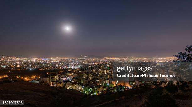 baam-e tehran - panoramic view from northern tehran at night, tehran roof skyline, islamic republic of iran - tehran polution stock pictures, royalty-free photos & images