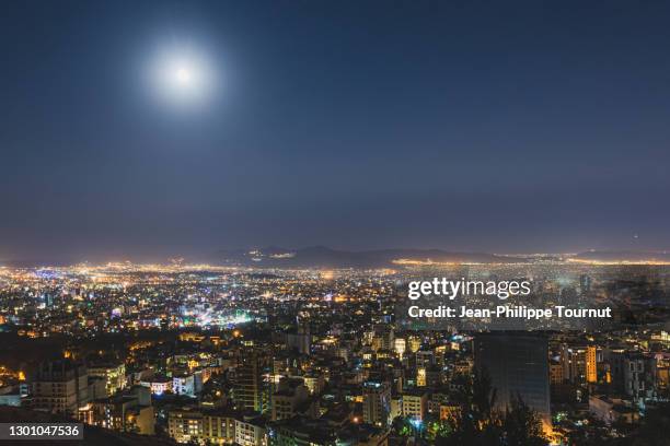 tehran skyline at night, view from baame tehran on a hill of northern tehran, iran - tehran skyline stock pictures, royalty-free photos & images