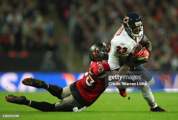 Devin Hester of the Chicago Bears is tackled by Aqib Talib of the Tampa Bay Buccaneers during the NFL International Series match between Chicago...