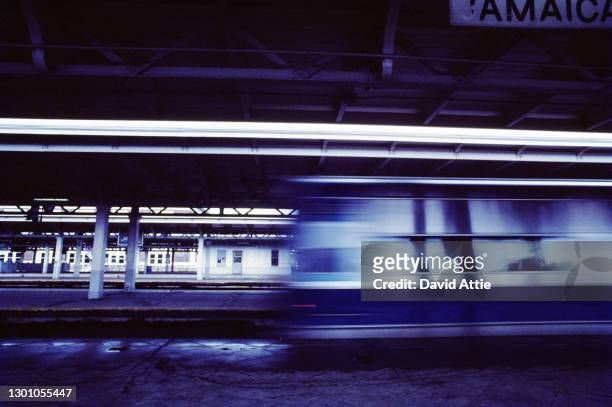 An LIRR commuter train speeds through Jamaica Station in March 1962 in New York City, New York.