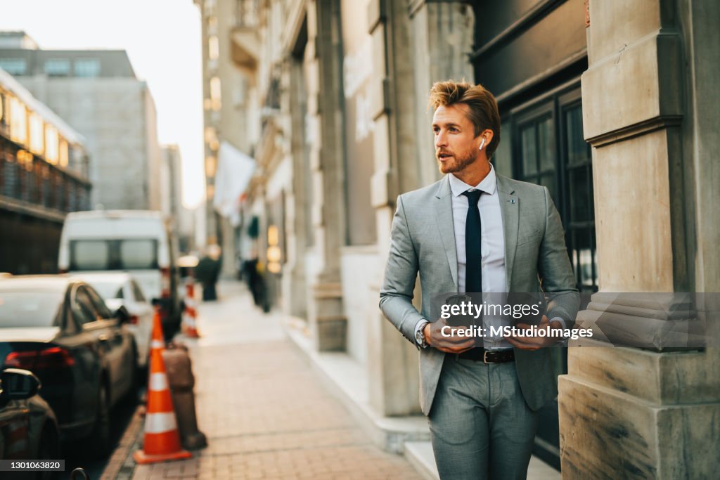 Handsome businessman walking