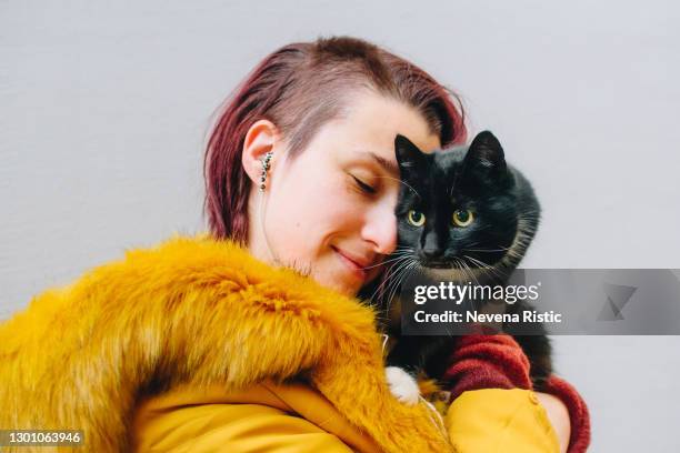 crazy cat lady stock photo - cat and owner stock pictures, royalty-free photos & images