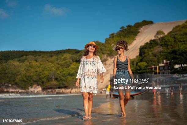 mother and daughter on the beach of rio grande do norte natal - rio grande stock pictures, royalty-free photos & images