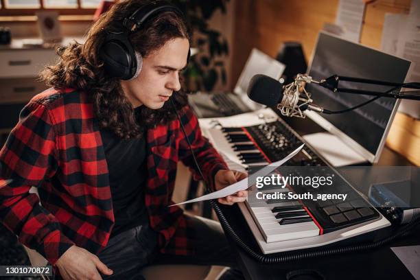 male artist making music in recording studio - make music day stock pictures, royalty-free photos & images