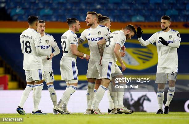 Jack Harrison of Leeds United celebrates scoring their sides first goal with Raphinha, Ezgjan Alioski, Liam Cooper, Stuart Dallas and Mateusz Klich...