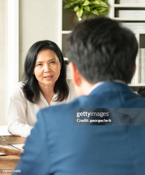 meeting with the manager - serious interview stock pictures, royalty-free photos & images