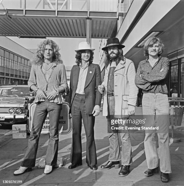 English rock band Led Zeppelin at Heathrow Airport in London, UK, 11th June 1973. From left to right, they are singer Robert Plant, guitarist Jimmy...
