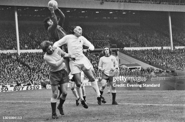 Alan Gilzean of Spurs tangles with Dave Stringer and Kevin Keelan during the 1973 Football League Cup Final between Tottenham Hotspur and Norwich...