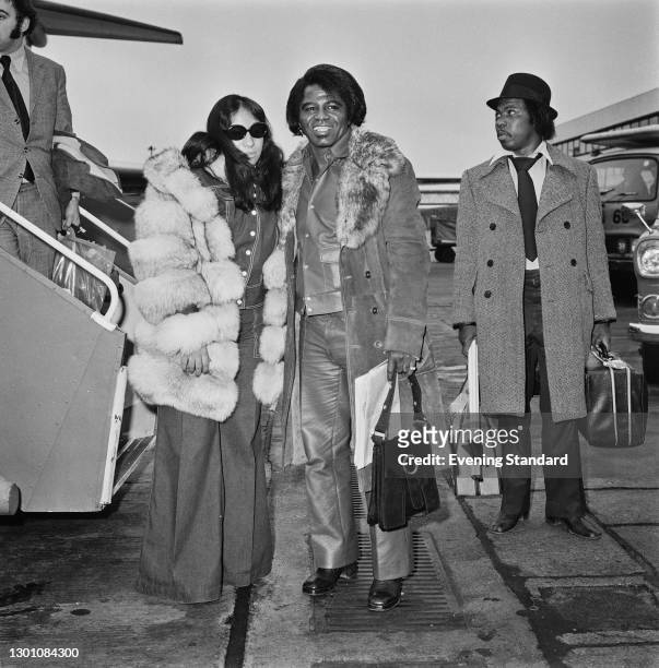 American singer and songwriter James Brown arrives at Heathrow Airport in London from Paris, accompanied by his wife Deidre or Dee Dee, née Jenkins,...