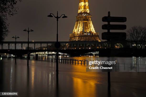 The banks of the Seine are submerged by flood water near the Eiffel Tower on February 08, 2021 in Paris, France. Heavy rains caused the level of the...