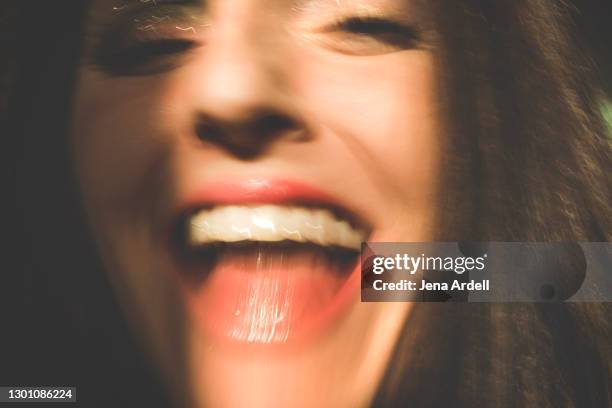 hilarious woman laughing closeup mouth - drunk stockfoto's en -beelden