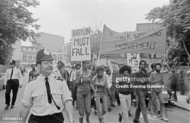 Demonstration in Brixton, south London, by the Black Workers' Movement , UK, 4th July 1973. One placard reads 'Babylon Must Fall'.