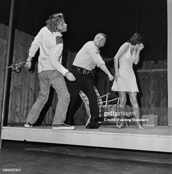 From left to right, actors Mark McManus , Ed Devereaux and Carole Mowlam appear in the stage play 'The Removalists' by David Williamson at the Royal...