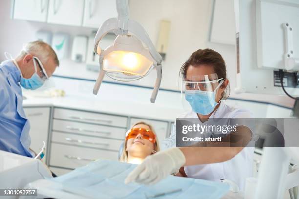 covid safe dental nurse - face shield stock pictures, royalty-free photos & images