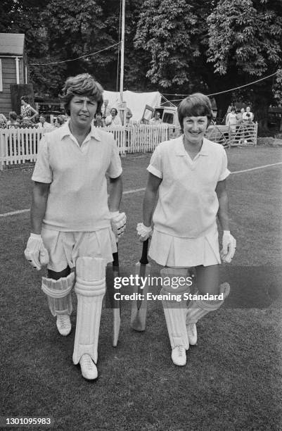 Audrey Disbury and Heather Dewdney of the England women's cricket team going out to bat, UK, 20th August 1973.