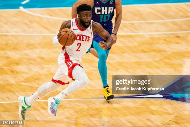 David Nwaba of the Houston Rockets brings the ball up court against the Charlotte Hornets during the second quarter at Spectrum Center on February...