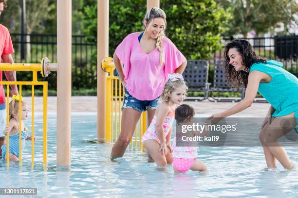 play date at children's pool - mother and baby taking a bath stock pictures, royalty-free photos & images