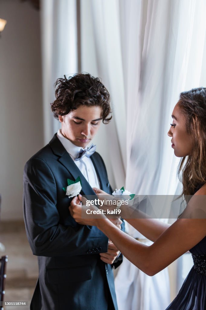 Teenage couple dressed for prom
